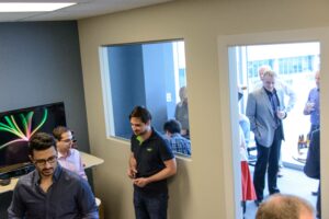 14 Oranges Open House People talking in two rooms