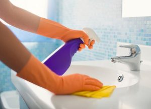 14 Oranges Person Cleaning the bathroom