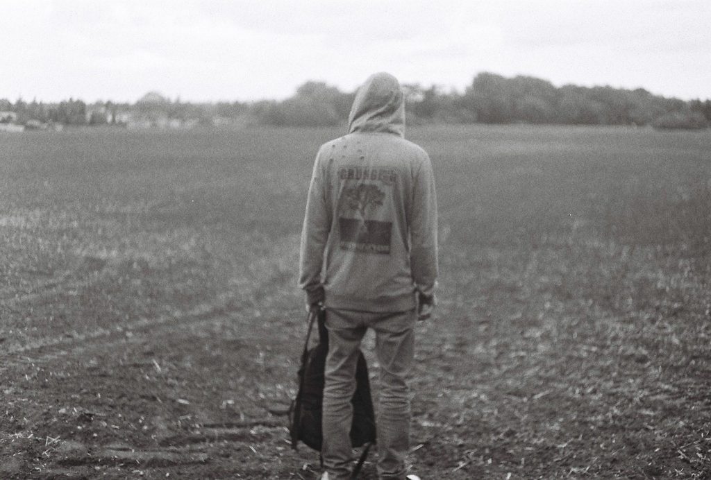 14 Oranges Black and White Image of person in field 