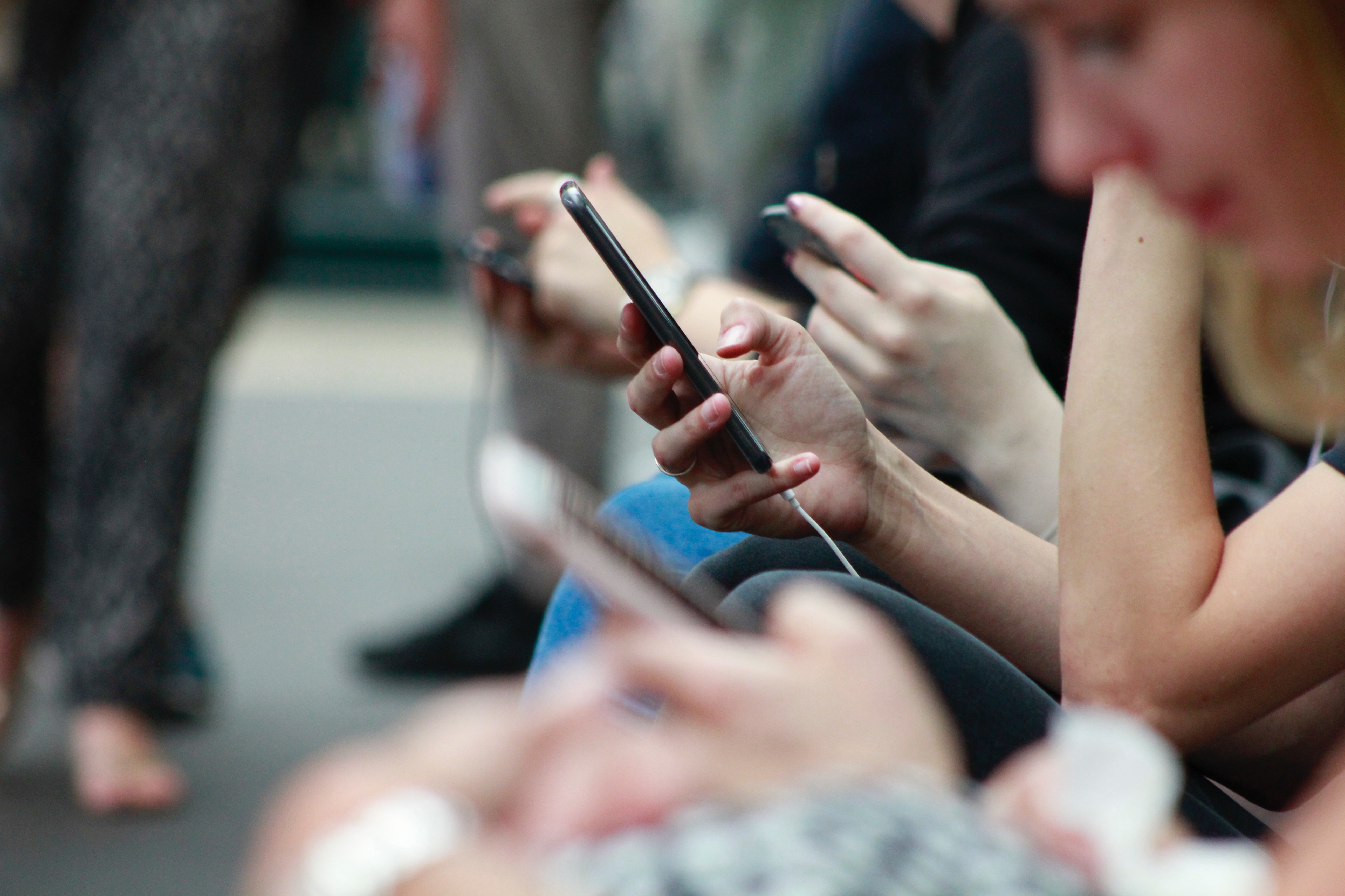 14 Oranges Blog Users looking at Cellphones