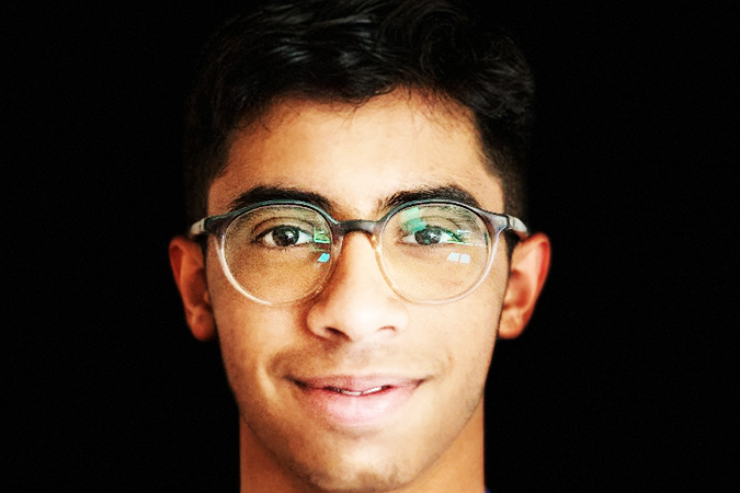 14 Oranges Blog Yasin Ladha Blog Male with Glasses smiling at camera