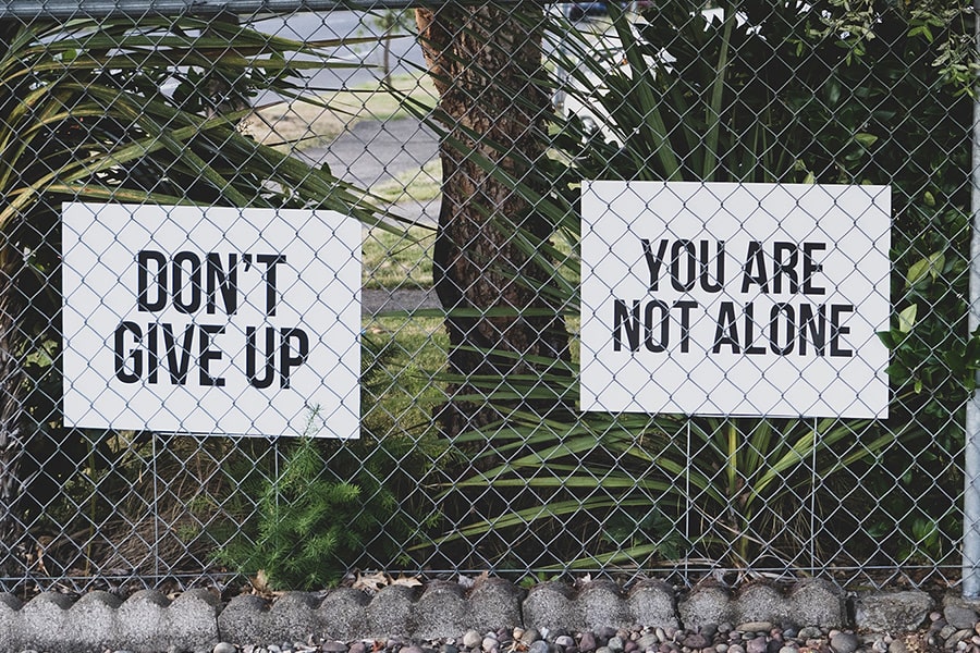 14 Oranges Signs with Don’t Give Up and You Are Not Alone